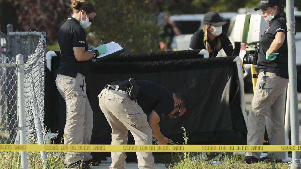 Police investigate an officer-involved shooting at 5400
South and 5400 West in Kearns on Tuesday, Aug. 4, 2020.
