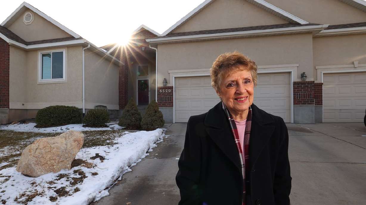 Madelene Lee poses for a photo outside of her home in
West Jordan on Wednesday, Dec. 16, 2020. She and her husband
supplement their income by renting out their basement to a couple
and by hosting foreign exchange students.