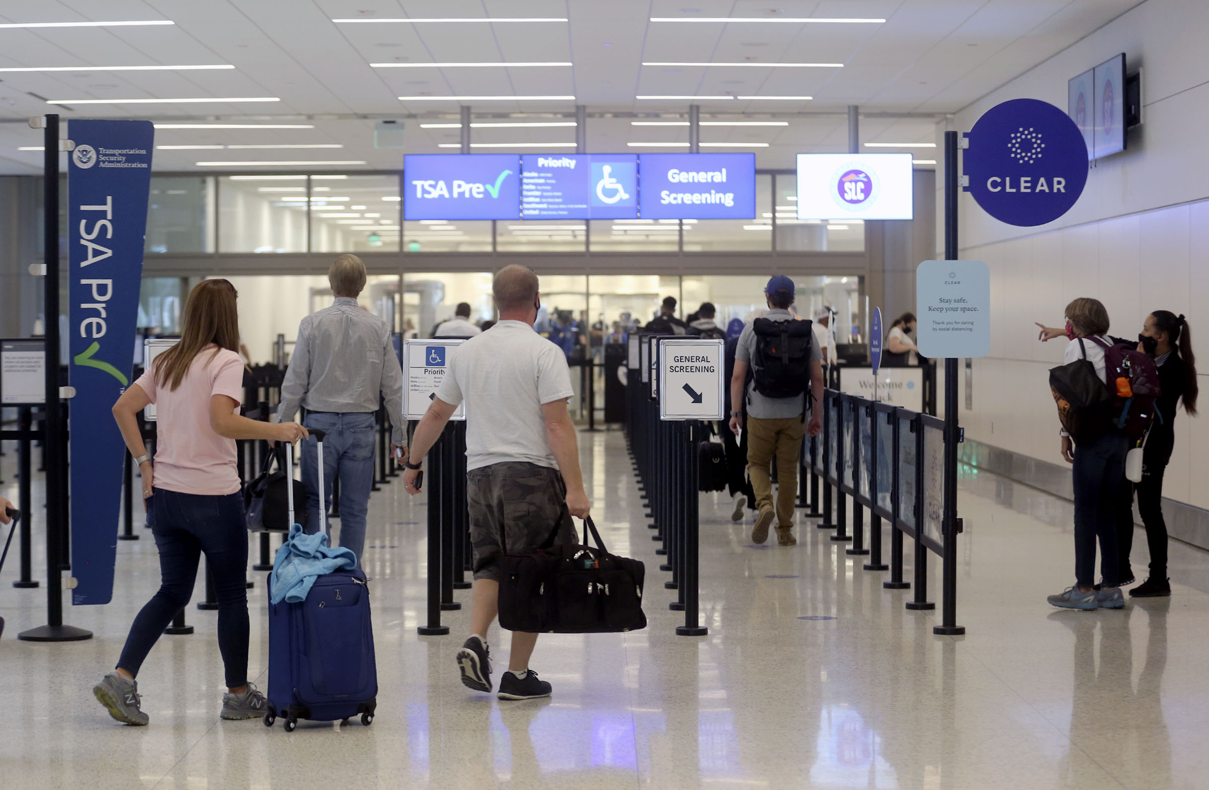 Travelers make their way through the Transportation Security Administration checkpoint at the new Salt Lake City International Airport on Tuesday, Sept. 22, 2020.