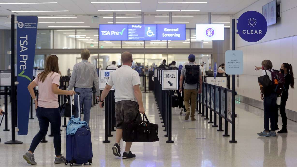 Travelers make their way through the Transportation Security Administration checkpoint at the new Salt Lake City International Airport on Tuesday, Sept. 22, 2020.