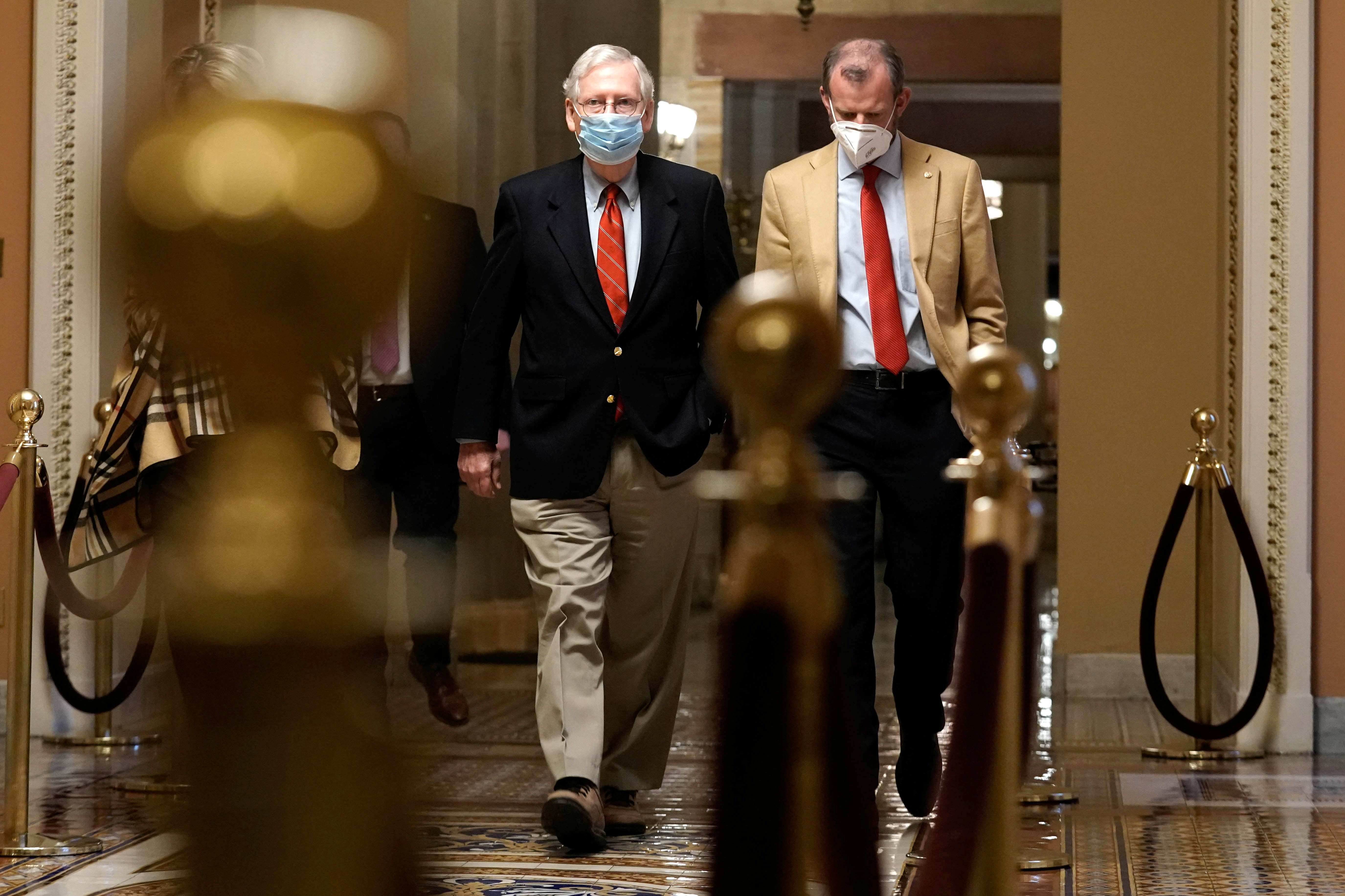U.S. Sen. Majority Leader Mitch McConnell (R-KY) walks from his office to the Senate floor on Capitol Hill Washington, D.C., U.S. Sunday, December 20, 2020.  REUTERS/Ken Cedeno