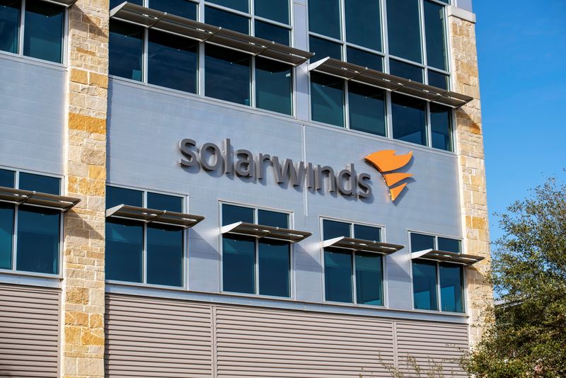 FILE PHOTO: The SolarWinds logo is seen outside its headquarters in Austin, Texas, U.S., December 18, 2020. REUTERS/Sergio Flores