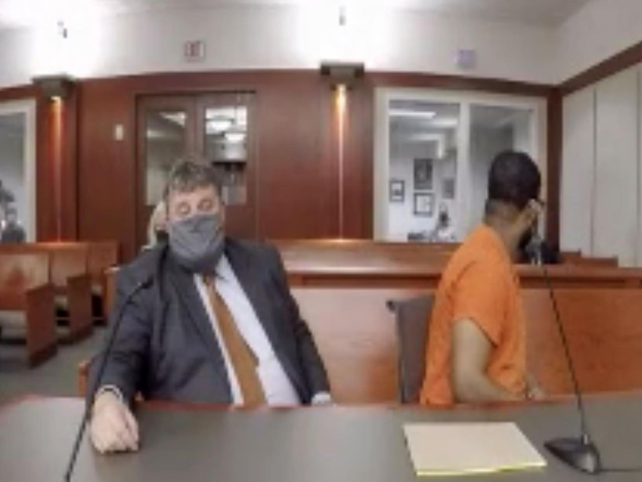 Defense attorney Neal Hamilton, left, and Ayoola Adisa
Ajayi, right, listen as Ajayi is sentenced in Salt Lake City’s 3rd
District Court on Friday, Oct. 22, 2020, to life in the Utah State
Prison without the possibility of parole in the death of University
of Utah student Mackenzie Lueck.