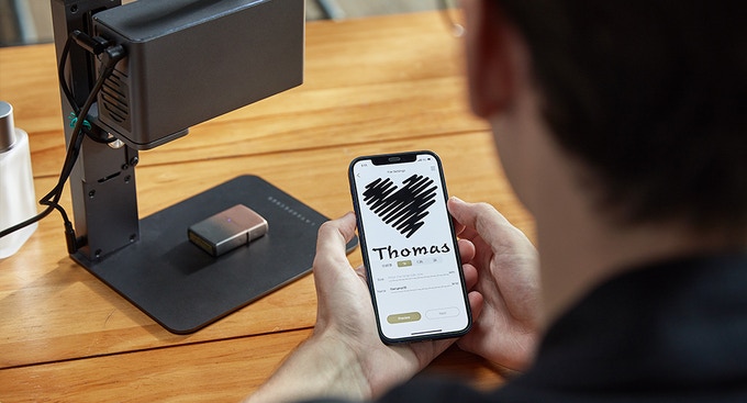 The LaserPecker 2 is a handhelt laser engraver that works on many different materials, from wood to glass to ceramic, even to your smartphone or laptop.