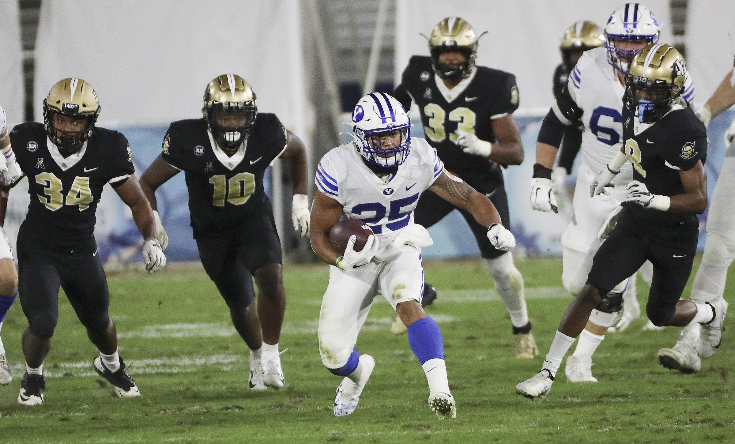 Brigham Young Cougars running back Tyler Allgeier (25) runs during the Boca Raton Bowl in Boca Raton, Fla., on Tuesday, Dec. 22, 2020.