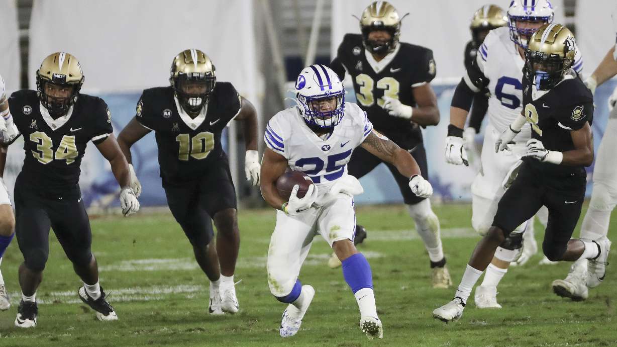 Brigham Young Cougars running back Tyler Allgeier (25) runs during the Boca Raton Bowl in Boca Raton, Fla., on Tuesday, Dec. 22, 2020.
