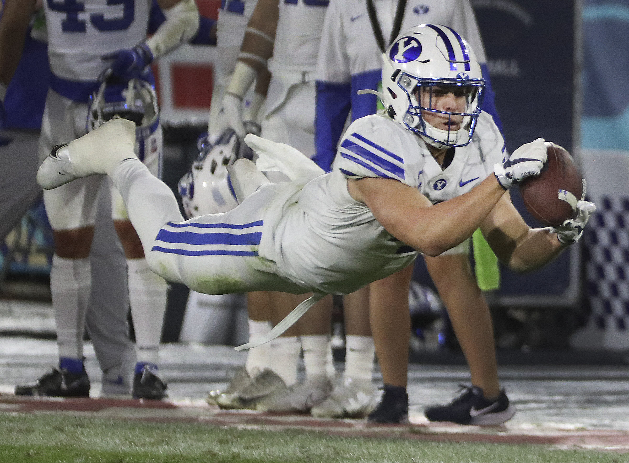 Brigham Young Cougars running back Lopini Katoa (4) makes a diving catch against the UCF Knights during the Boca Raton Bowl in Boca Raton, Fla., on Tuesday, Dec. 22, 2020.