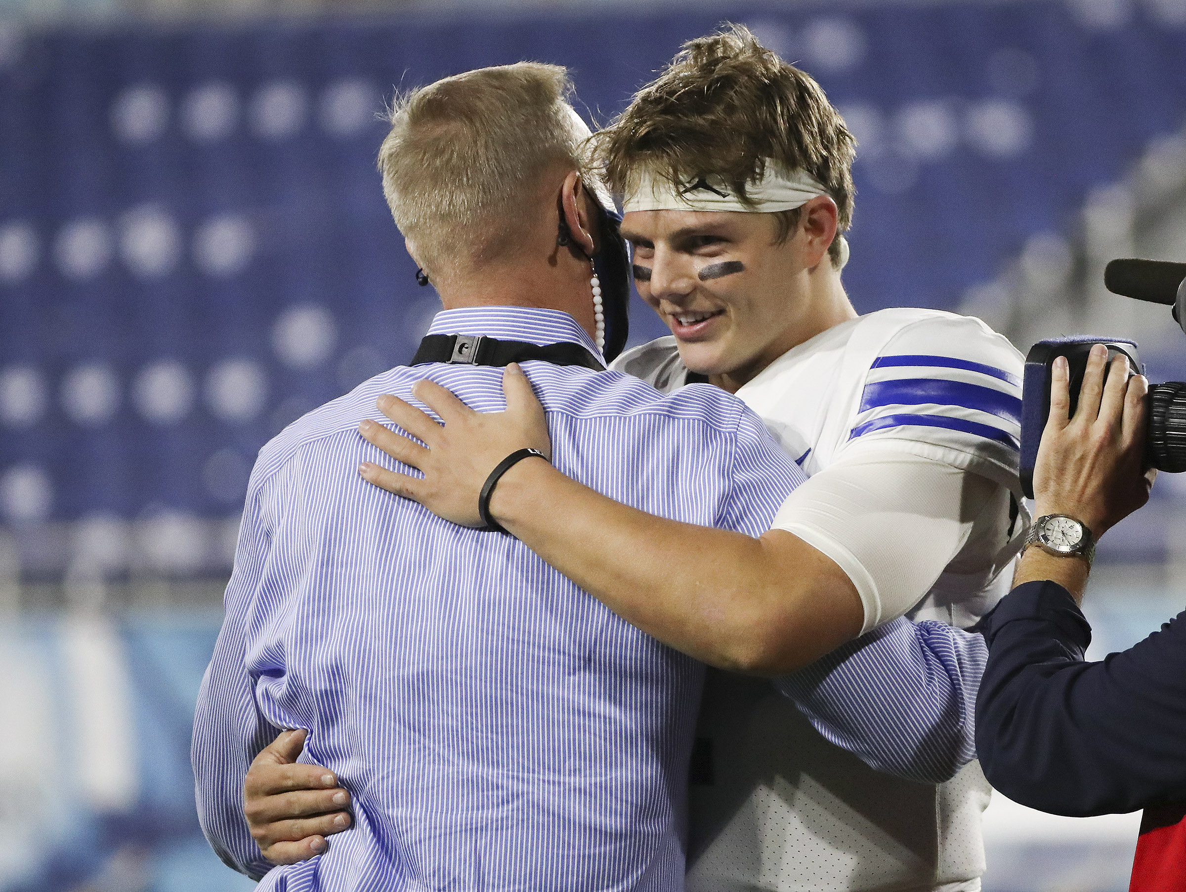 Brigham Young Cougars quarterback Zach Wilson (1) celebrates the win over the UCF Knights with athletic director Tom Holmoe after the Boca Raton Bowl in Boca Raton, Fla., on Tuesday, Dec. 22, 2020. BYU won 49-23.