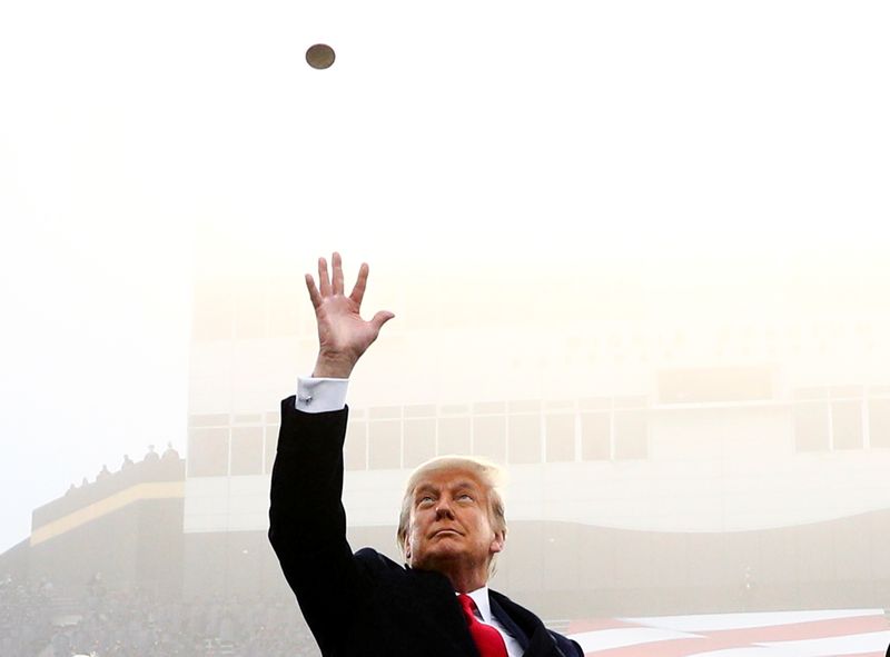 FILE PHOTO: U.S. President Trump participates in a pre-game coin toss ahead of the annual Army-Navy college football game at Michie Stadium, in West Point, New York, U.S., Dec. 12, 2020. REUTERS/Tom Brenner