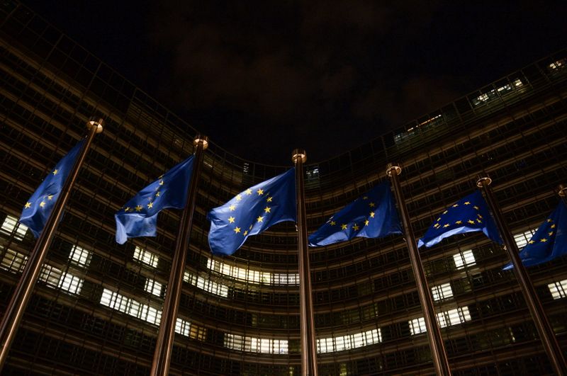 European Union flags flutter in front of the European Commission headquarters, in Brussels, Belgium December 23, 2020. REUTERS/Johanna Geron