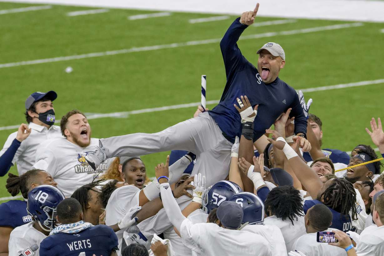 Georgia Southern coach Chad Lunsford and players celebrate the team's victory over Louisiana Tech in the New Orleans Bowl NCAA college football game in New Orleans, Wednesday, Dec. 23, 2020.