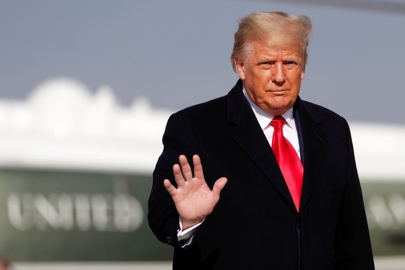 FILE PHOTO: U.S. President Donald Trump waves before boarding Air Force One at Joint Base Andrews, Maryland, U.S., Dec. 12, 2020. REUTERS/Tom Brenner