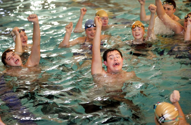 Lance Gillespie leads the swim team in a cheer after
practice in Layton on Friday, Dec. 4, 2020. Gillespie is captain of
the Davis High School varsity swim team.