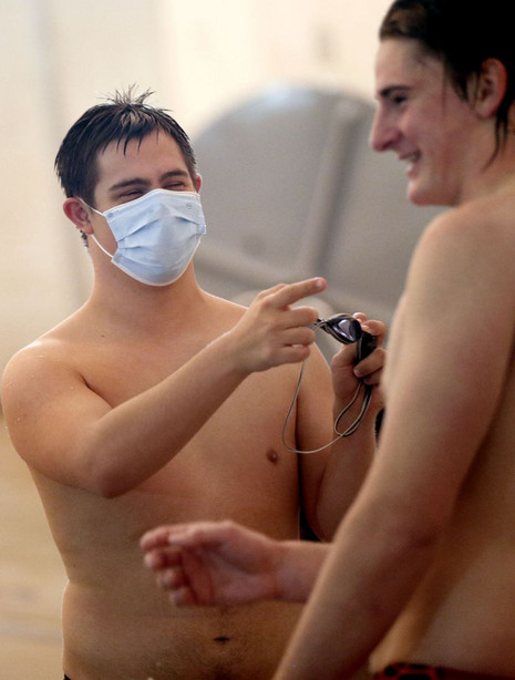 Lance Gillespie jokes around with teammate Jonathan
Page during practice in Layton on Friday, Dec. 4, 2020. Gillespie
is captain of the Davis High School varsity swim team.