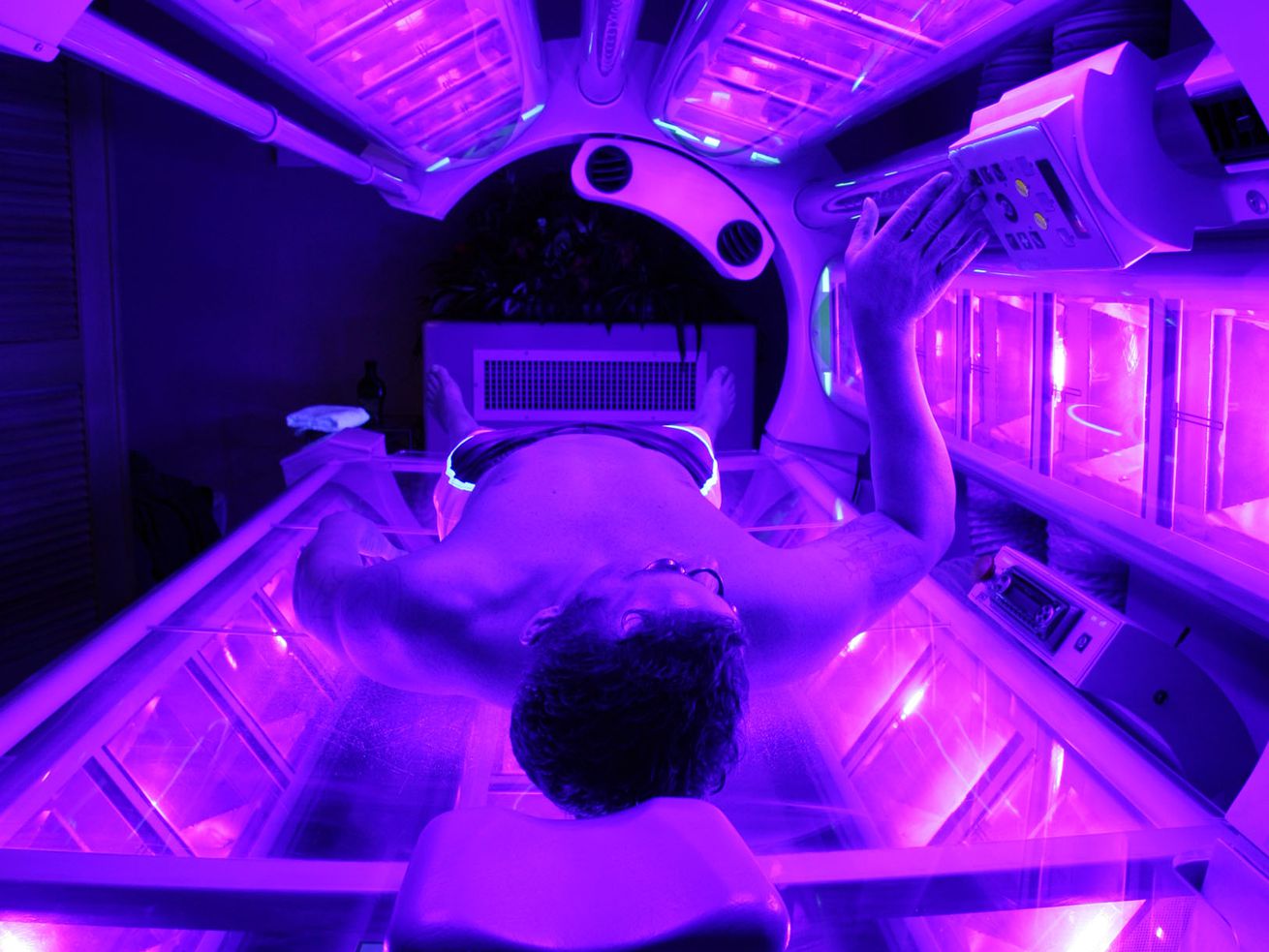 A man uses a tanning bed in this 2007 file photo. A
newly published Brigham Young University study found that students
there are largely ignoring winter’s skin cancer risks by hardly
ever wearing sunscreen and increasing their tanning bed use when
the weather turns cold.
