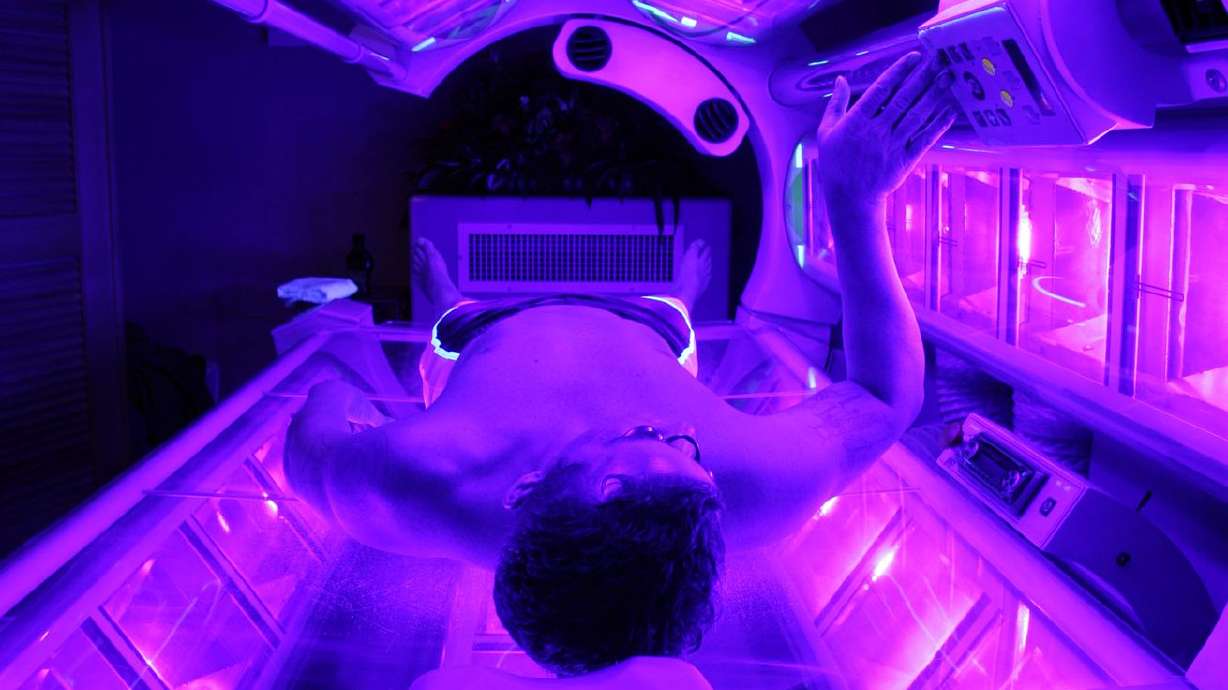 A man uses a tanning bed in this 2007 file photo. A
newly published Brigham Young University study found that students
there are largely ignoring winter’s skin cancer risks by hardly
ever wearing sunscreen and increasing their tanning bed use when
the weather turns cold.