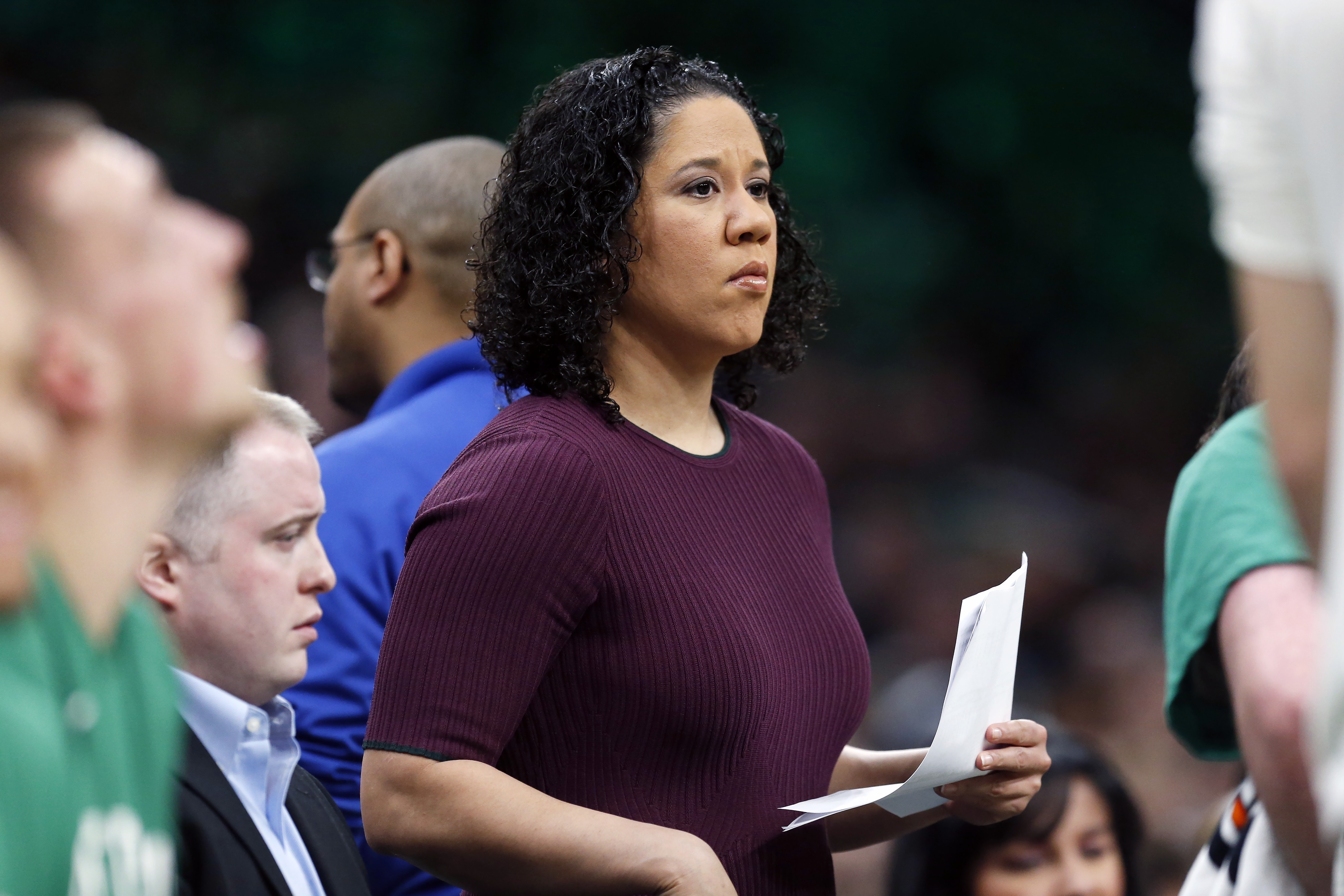 FILE - In this Dec. 28, 2019, file photo, then-Boston Celtics assistant coach Kara Lawson watches during the first half of an NBA basketball game against the Toronto Raptors in Boston. The Duke women's basketball team has ended its season amid the coronavirus pandemic, a person familiar with the situation told The Associated Press.  The person spoke on condition of anonymity Friday, Dec. 25, 2020, because the school has not publicly announced the decision. Duke's new coach Kara Lawson, who was hired in July, had said this month: “I don't think we should be playing right now. That's my opinion on it."  (AP Photo/Michael Dwyer, File) [Dec-25-2020]