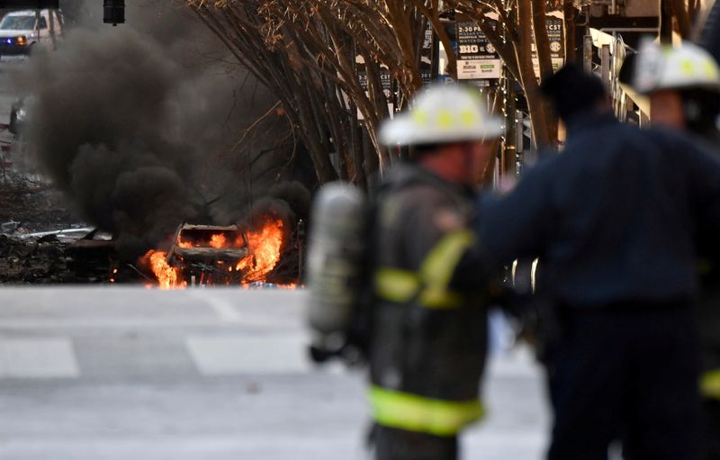 FILE PHOTO: A vehicle burns near the site of an explosion in the area of Second and Commerce in Nashville, Tennessee, U.S. December 25, 2020. Andrew Nelles/Tennessean.com/USA TODAY NETWORK via REUTERS.