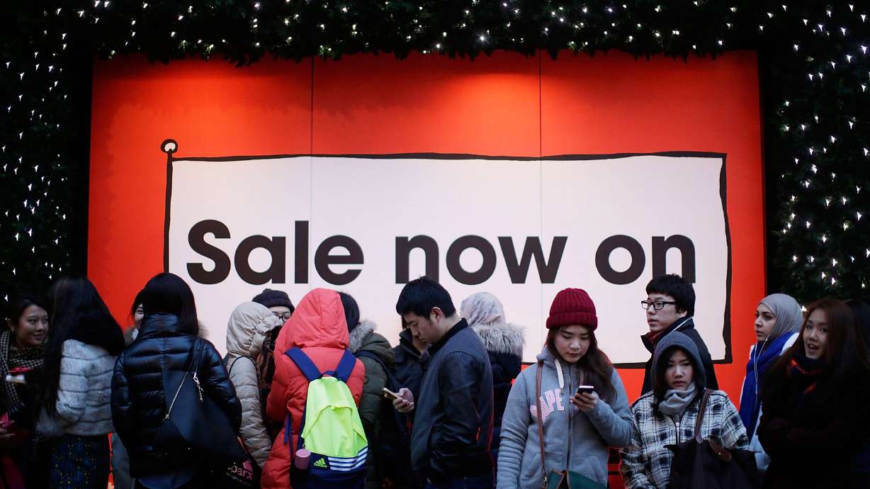 People in London wait in line in anticipation of the Boxing Day sales at Selfridges.