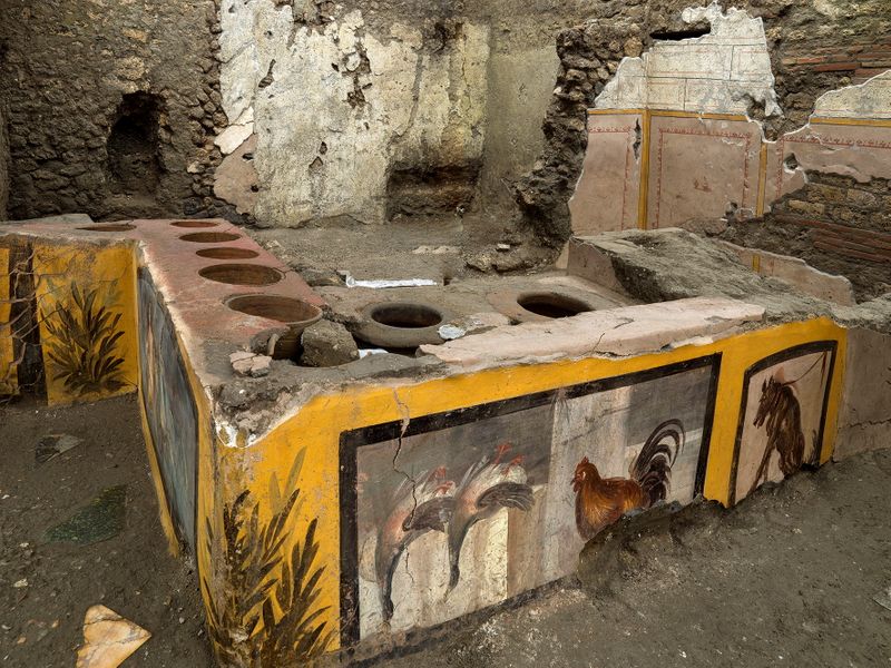 Frescoes on an ancient counter discovered during excavations at Pompeii, Italy, are seen in this handout picture released December 26, 2020.