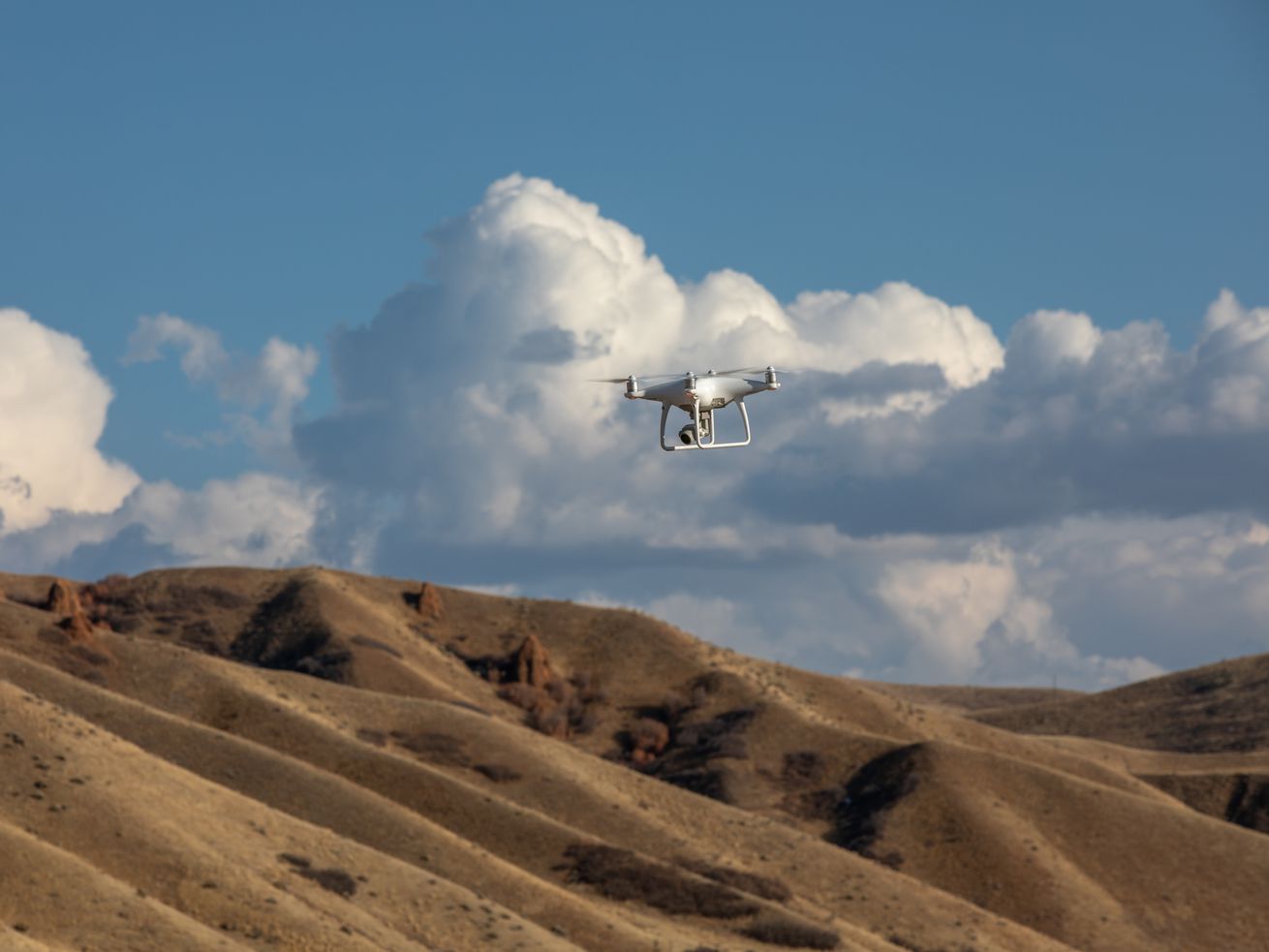 Weber State University geography student Timber
Erickson and professor Bryan Dorsey use a drone to explore
locations for a proposed wildlife crossing bridge over I-84 in
Summit County on Tuesday, Nov. 3, 2020. The research is part of a
senior project by Erickson.