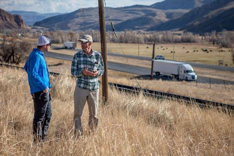 Weber State University geography student Timber
Erickson, left, and professor Bryan Dorsey, right, explore
locations for a proposed wildlife crossing bridge over I-84 in
Summit County on Tuesday, Nov. 3, 2020. The research is part of a
senior project by Erickson.