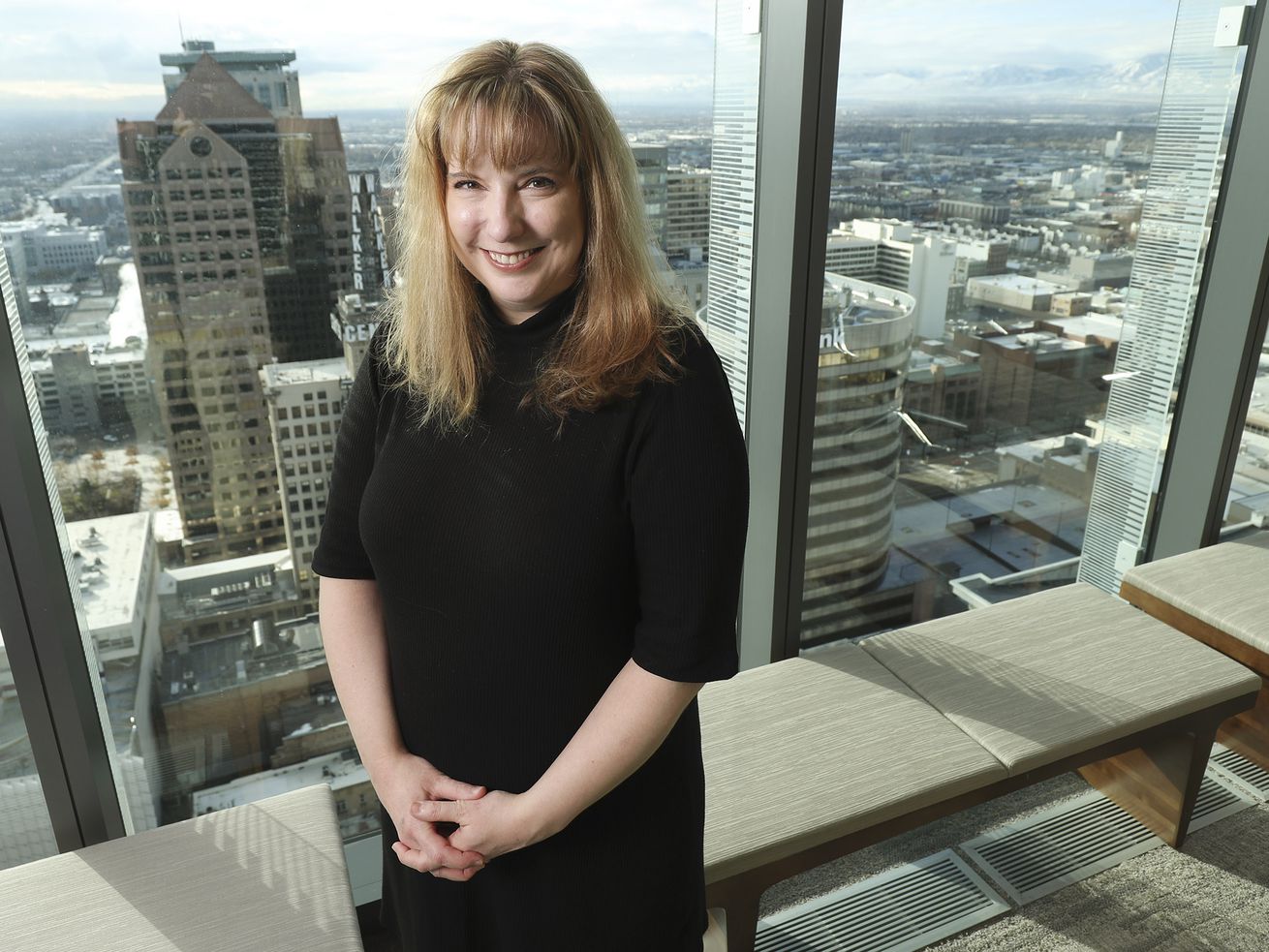 Kim Neville, a partner at law firm Dorsey and Whitney, poses for a photo in her office in Salt Lake City on Friday, Dec. 18, 2020.