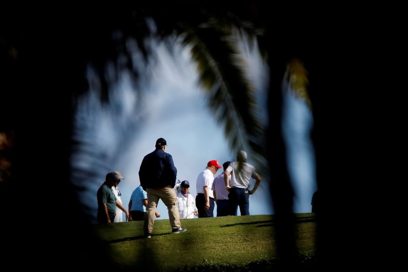 U.S. President Donald Trump plays golf at the Trump International Golf Club in West Palm Beach, Florida, U.S., December 27, 2020. REUTERS/Marco Bello