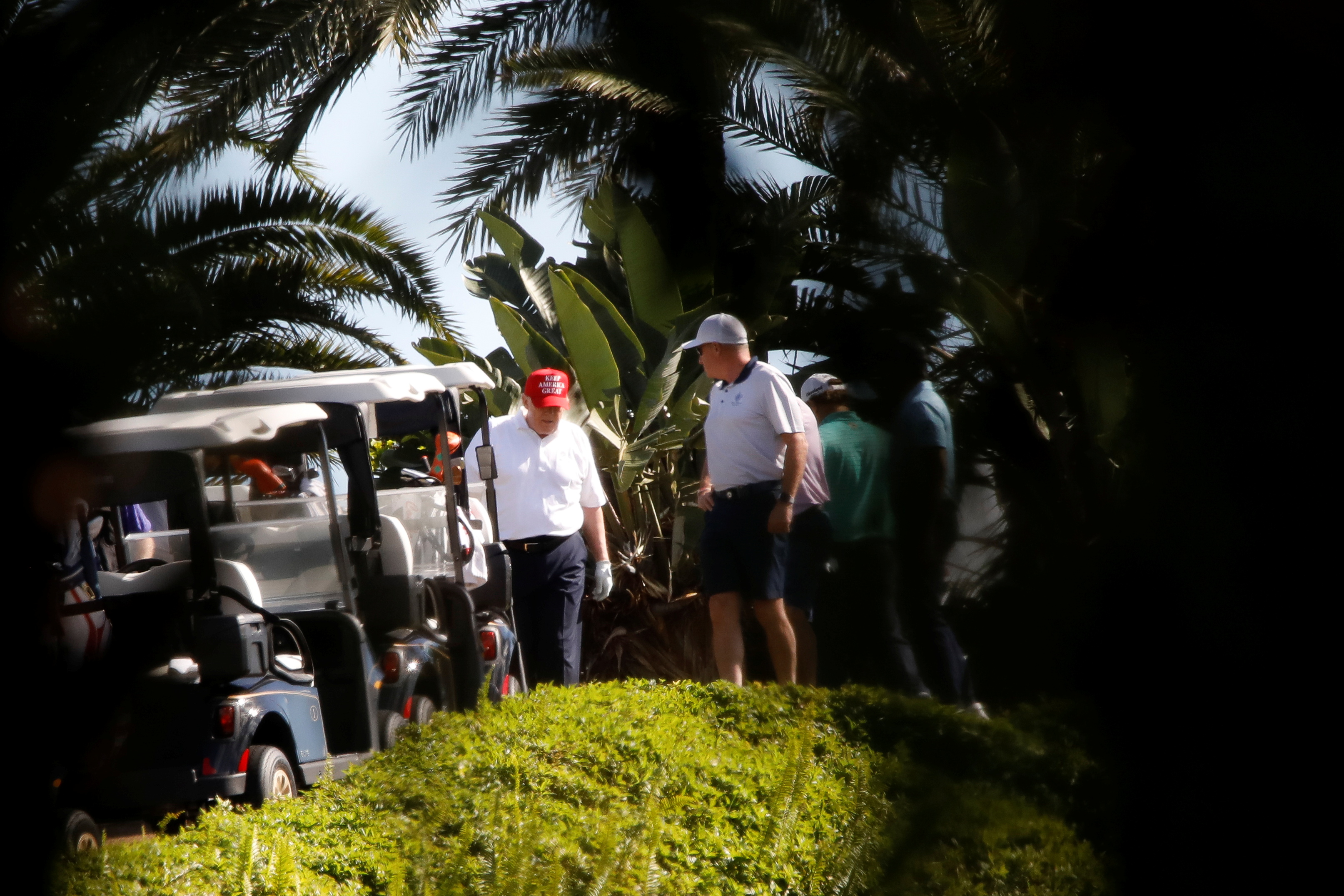 U.S. President Donald Trump plays golf at the Trump International Golf Club in West Palm Beach, Florida, U.S., December 27, 2020.