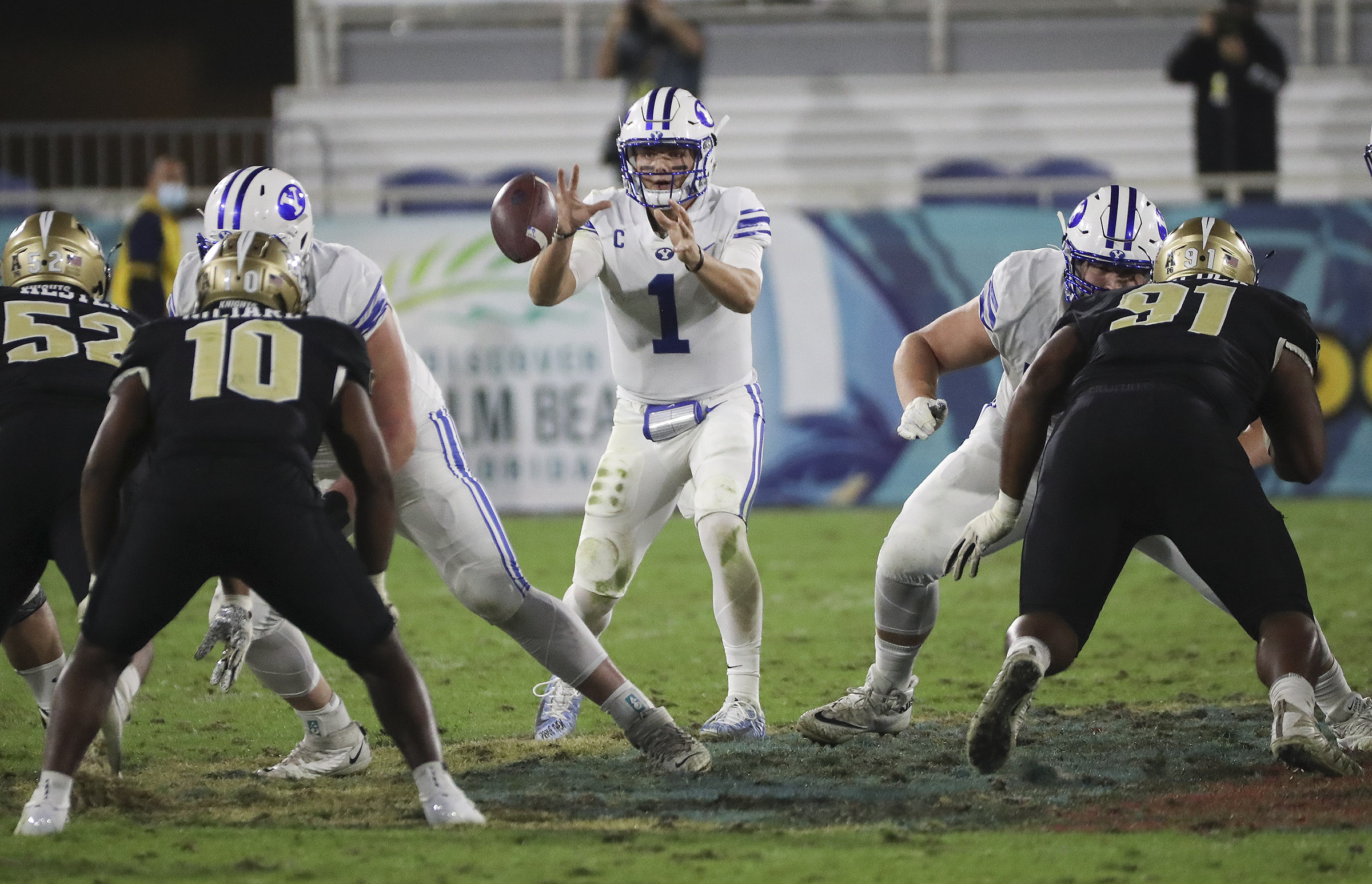 Brigham Young Cougars quarterback Zach Wilson (1) takes a snap during the Boca Raton Bowl in Boca Raton, Fla., on Tuesday, Dec. 22, 2020.