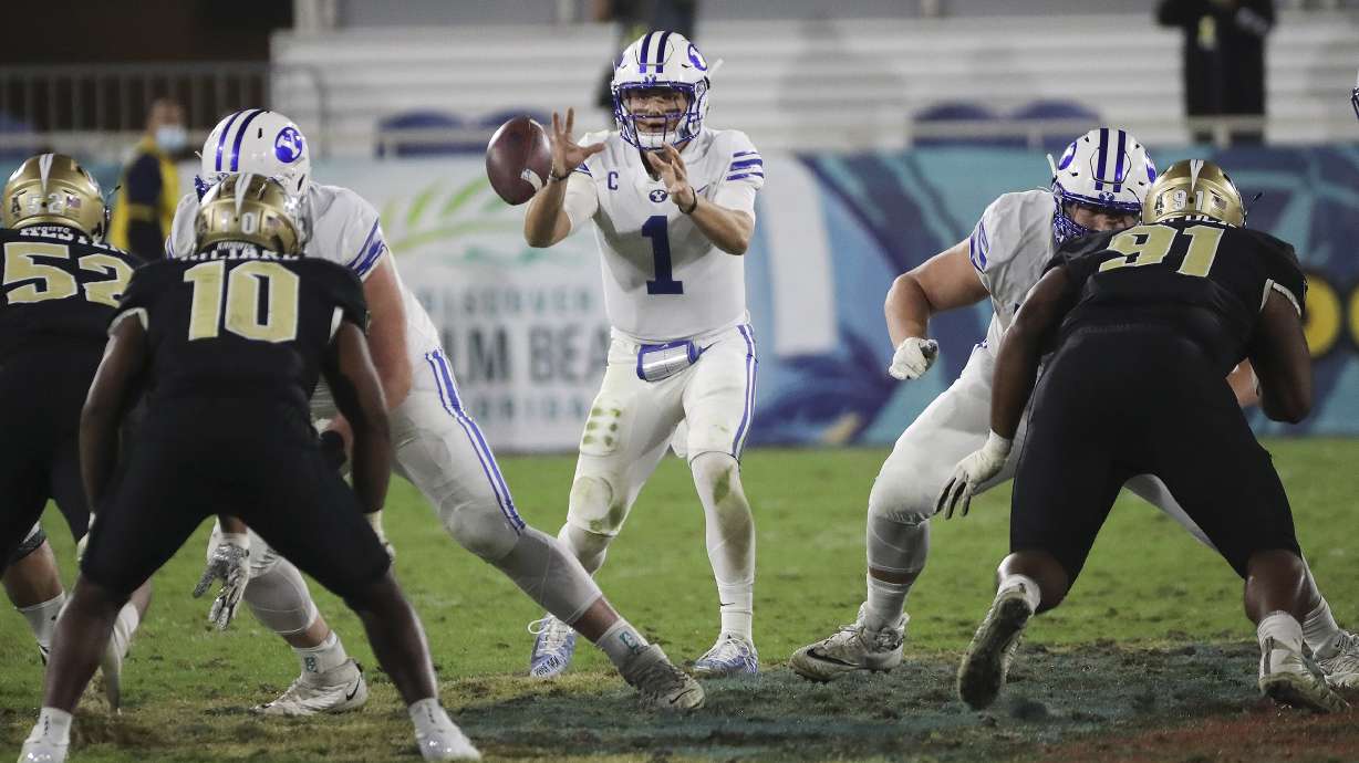 Brigham Young Cougars quarterback Zach Wilson (1) takes a snap during the Boca Raton Bowl in Boca Raton, Fla., on Tuesday, Dec. 22, 2020.
