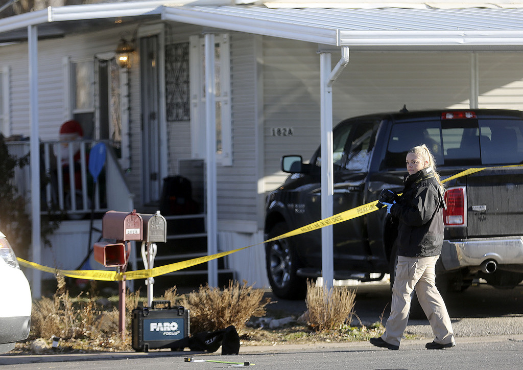 A Weber Metro CSI unit photographer works at the scene of a fatal shooting that occurred early Christmas morning in Riverdale, Weber County, on Friday, Dec. 25, 2020.