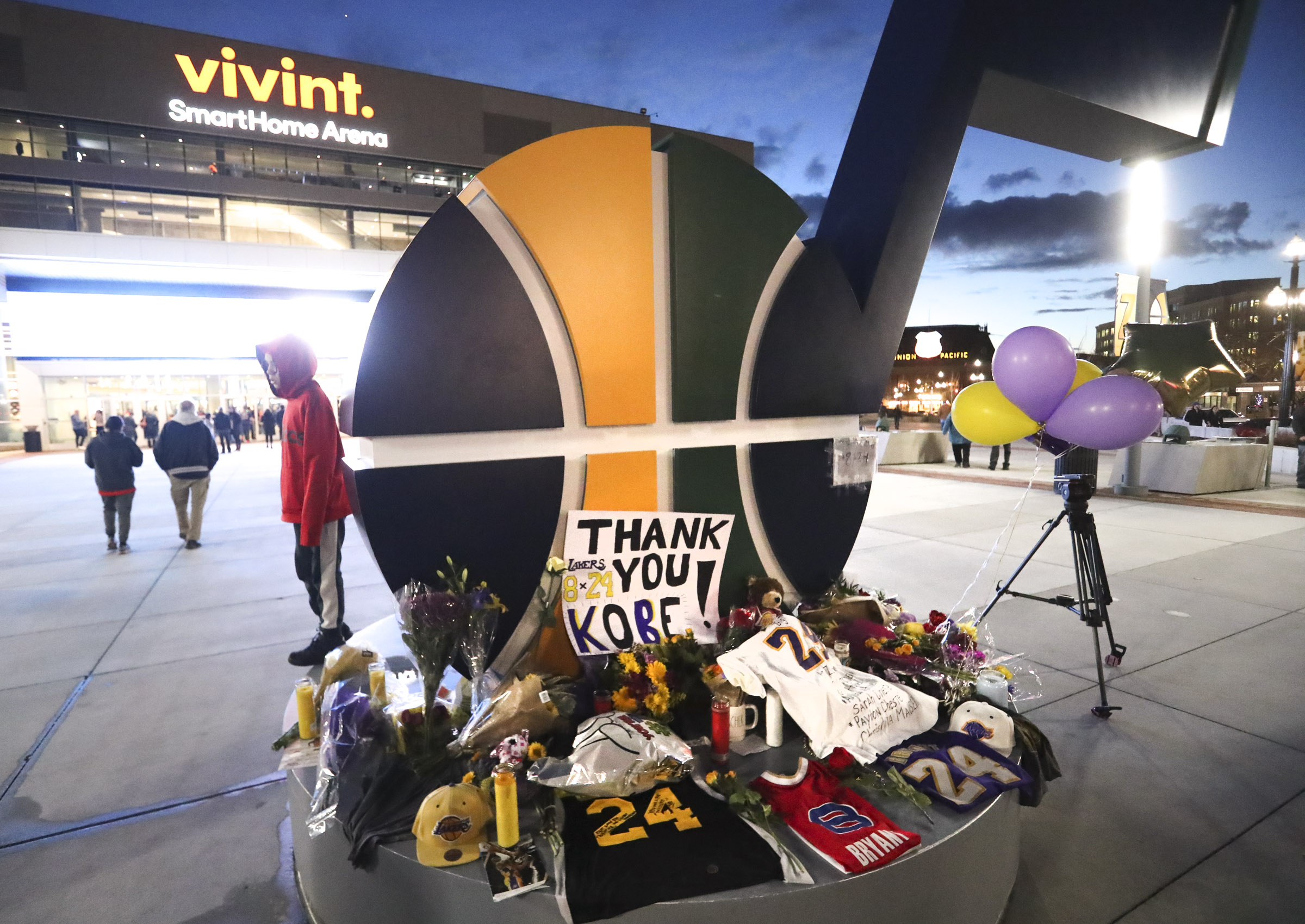 Basketball fans pay tribute to Kobe Bryant outside Vivint Arena in Salt Lake City on Monday, Jan. 27, 2020.