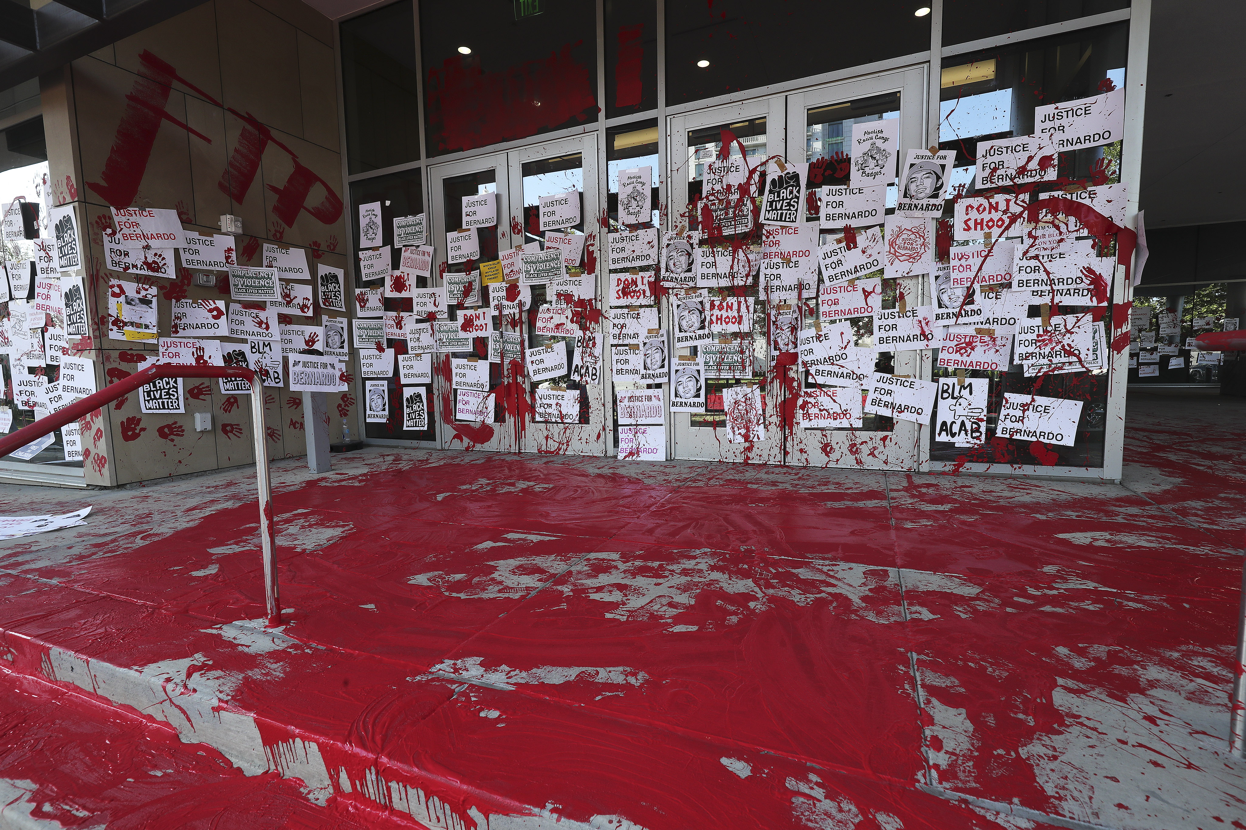 Protesters decrying the police shooting of Bernardo Palacios-Carbajal painted the entrance to the district attorney's office in Salt Lake City on Thursday, July 9, 2020.