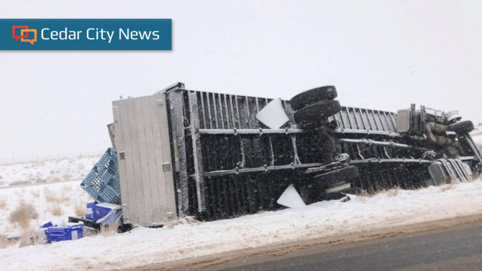 A semitractor-trailer is tipped over in the median of southbound I-15 near mile marker 133, north of Beaver, Utah, Dec. 28, 2020