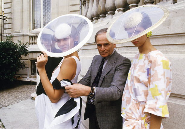 FILE - In this Sept.24, 1984 file photo, Paris couturier Pierre Cardin and models wearing ensembles from the summer 1985 ready-to-wear Cardin collection pose in Paris. France's Academy of Fine Arts says Pierre Cardin, the French designer whose Space Age style was among the iconic looks of 20th-century fashion, has died at 98.