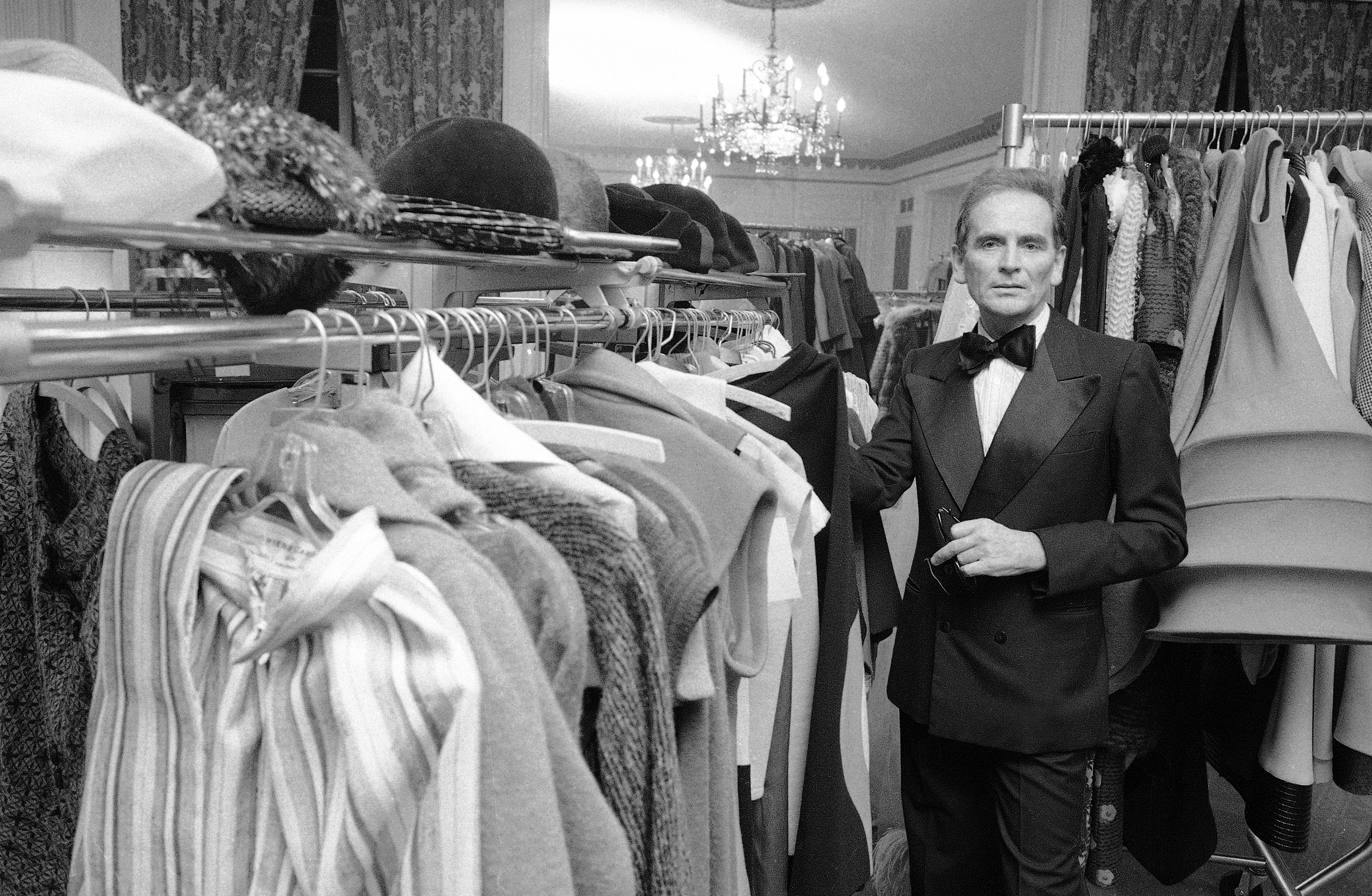 FILE - In this Oct.30 1975 file photo, French designer Pierre Cardin poses in the dressing room at Hotel Pierre in New York. France's Academy of Fine Arts says famed fashion designer Pierre Cardin has died at 98.