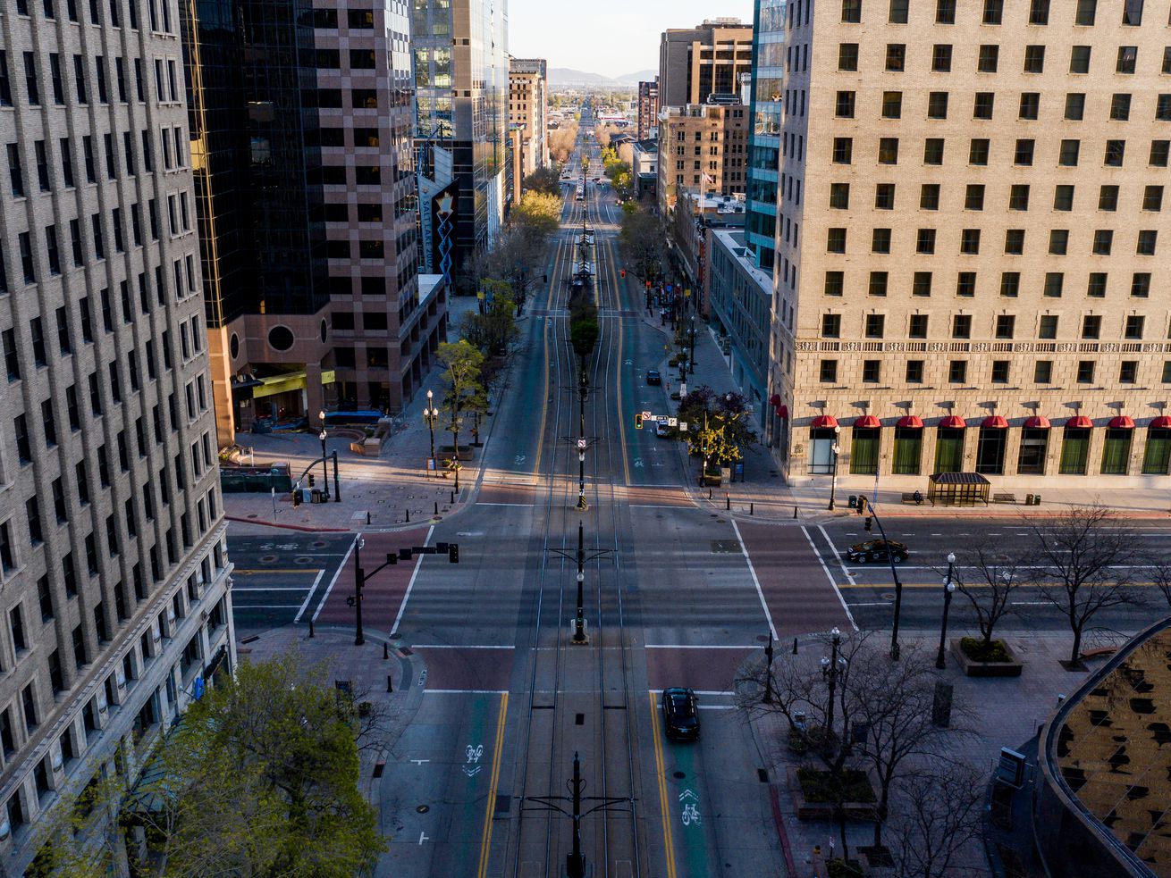 The streets of downtown Salt Lake City were unusually
quiet in April 14 as many workers stayed home as the COVID-19
pandemic began to take hold across Utah and the country, shutting
down businesses.