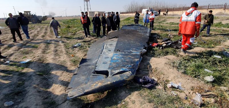 FILE PHOTO: General view of the debris of the Ukraine International Airlines, flight PS752, Boeing 737-800 plane that crashed after take-off from Iran's Imam Khomeini airport, on the outskirts of Tehran, Iran January 8, 2020 is seen in this screen grab obtained from a social media video via REUTERS