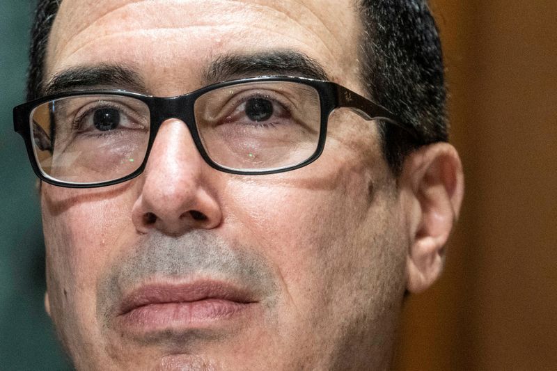 FILE PHOTO: Treasury Secretary Steven Mnuchin testifies during a hearing in Washington, U.S., December 10, 2020.  Sarah Silbiger/Pool via REUTERS