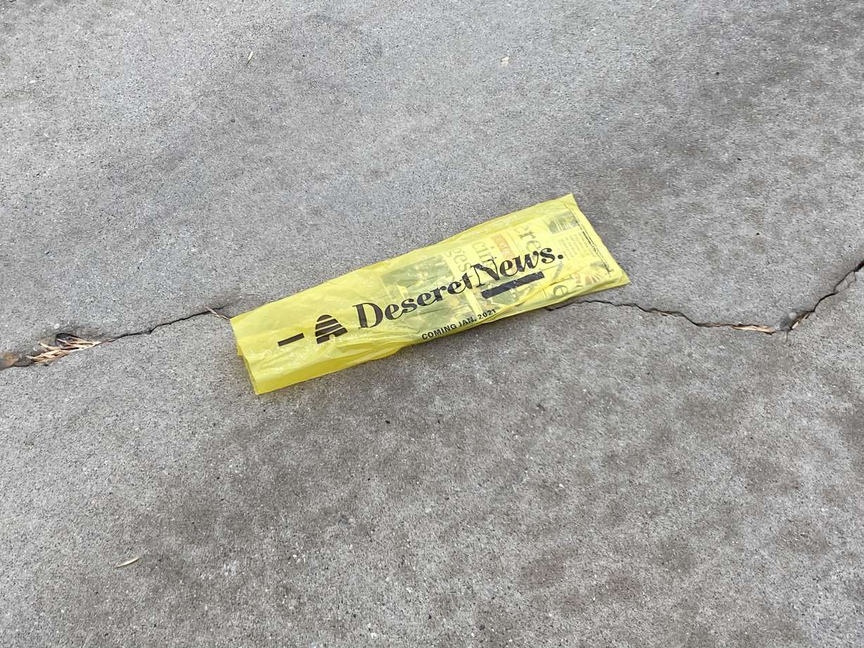 The Deseret News sits in the Bountiful driveway of JoEllen Ashworth on Thursday, Dec. 31, 2020. The newspaper will cease daily print publication on Friday.