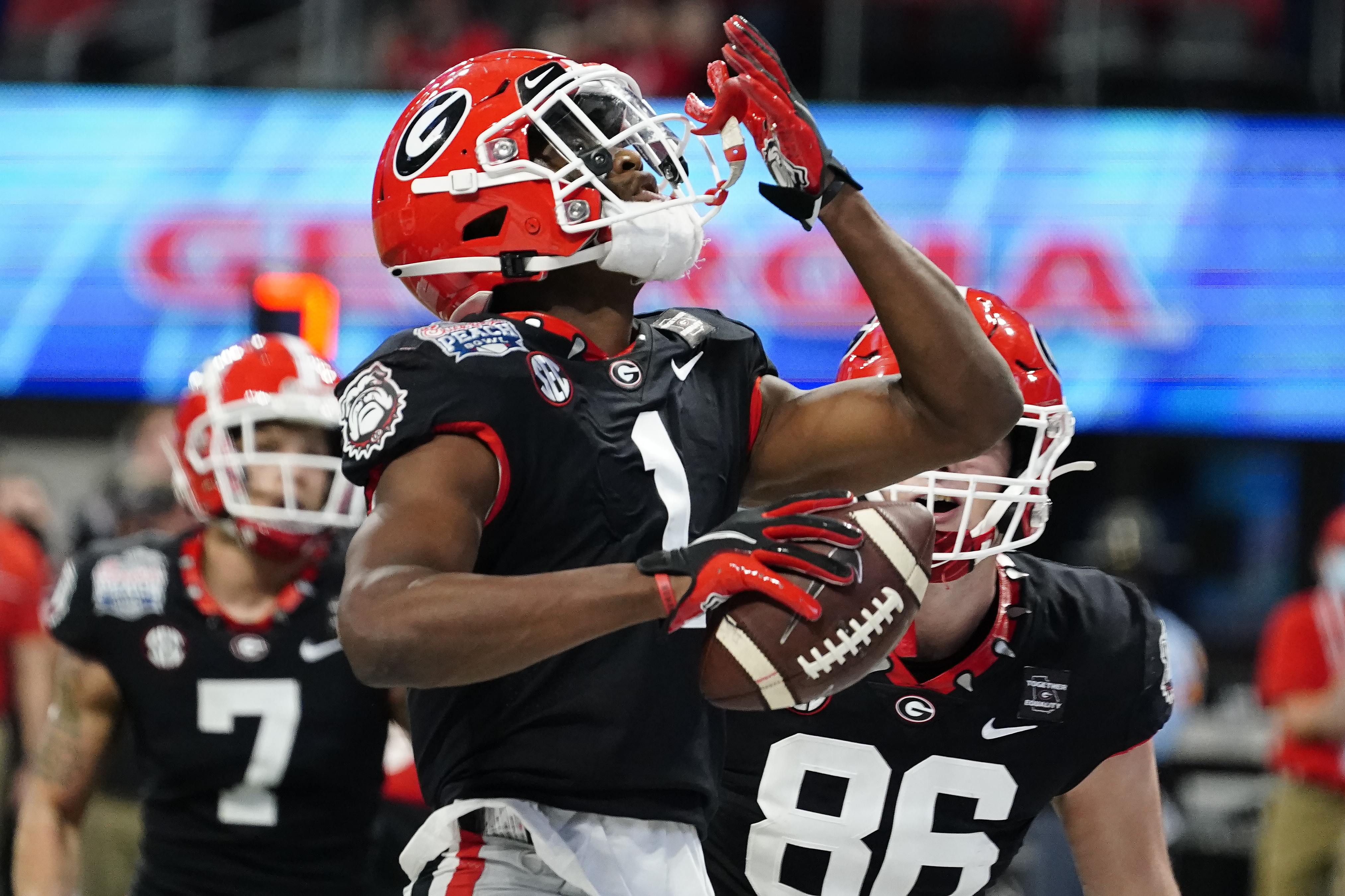 Georgia wide receiver George Pickens (1) celebrates his touchdown catch against Cincinnati during the first half of the Peach Bowl NCAA college football game, Friday, Jan. 1, 2021, in Atlanta. (AP Photo/Brynn Anderson) [Jan-01-2021]