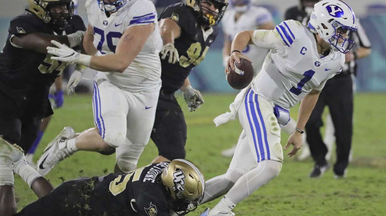 UCF linebacker Tatum Bethune (15) sacks BYU quarterback Zach Wilson (1) in the fourth quarter in the Boca Raton Bowl NCAA college football game at FAU Stadium in Boca Raton, Fla. Tuesday, Dec. 22, 2020.