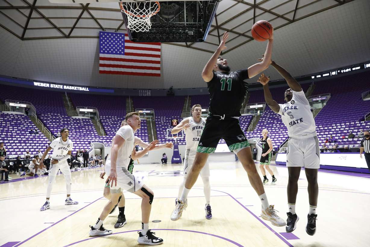 Fardaws Aimaq grabs a rebound for Utah Valley against Weber State, Satuday, Jan. 2, 2021 at the Dee Events Center in Ogden.