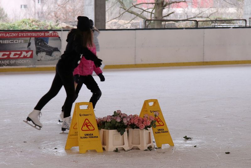 Flowers are seen as people are skating amid the coronavirus disease (COVID-19) restrictions at skating rink, in Szczecin, Poland January 2, 2021. A skating rink owner believes he has found a surefire way to keep his business open amidst the ongoing coronavirus restrictions - operate as a flower shop instead. Picture taken January 2,  2021. Cezary Aszkielowicz/Agencja Gazeta via REUTERS