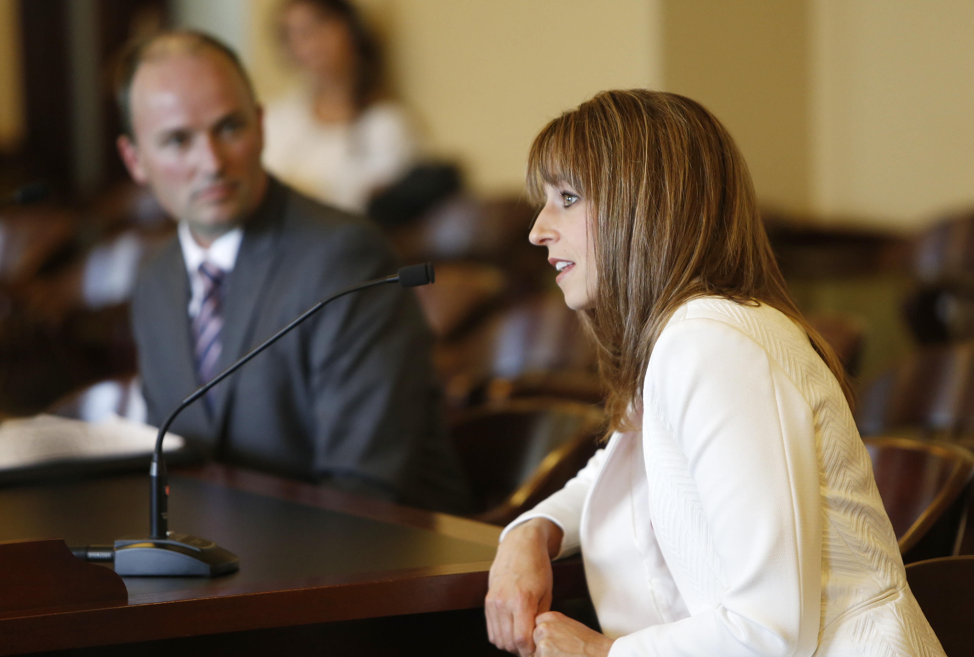 Abby Cox, wife of Rep. Spencer J. Cox, lieutenant governor appointee, speaks to the Senate Government Operations Confirmation Committee during a hearing at the state Capitol in Salt Lake City Tuesday, Oct. 15, 2013.