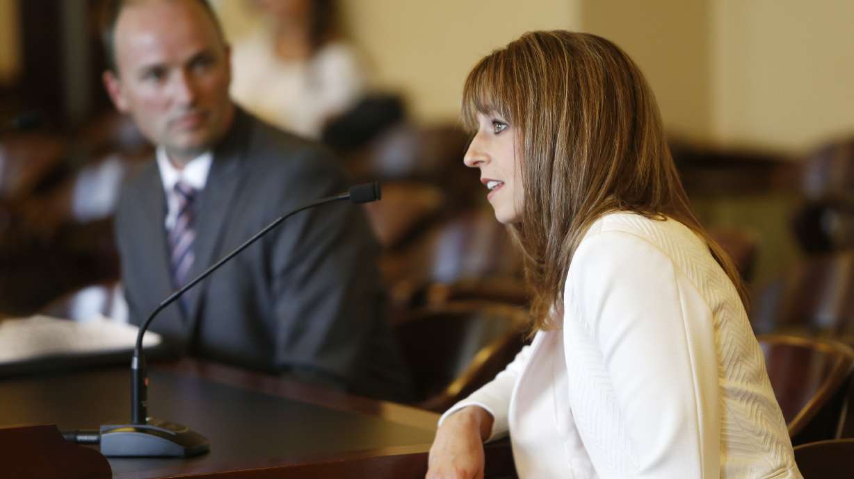 Abby Cox, wife of Rep. Spencer J. Cox, lieutenant governor appointee, speaks to the Senate Government Operations Confirmation Committee during a hearing at the state Capitol in Salt Lake City Tuesday, Oct. 15, 2013.