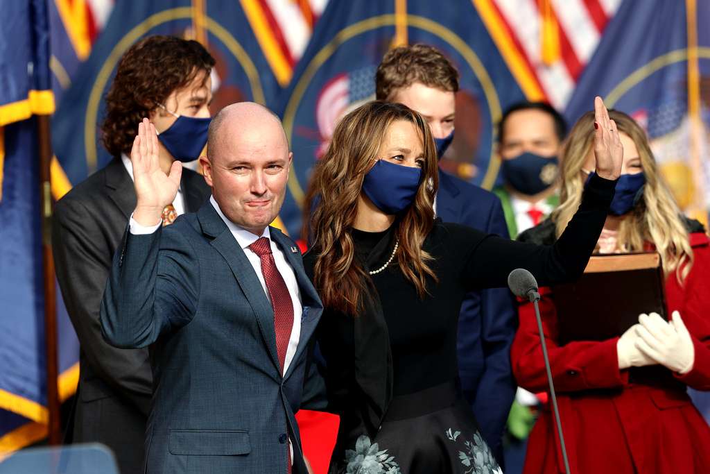 Utah Gov. Spencer Cox and his wife Abby wave after the administration of the oath of office during an inaugural event at Tuacahn Center for the Arts in Ivins, Washington County, near St. George on Monday, Jan. 4, 2021.