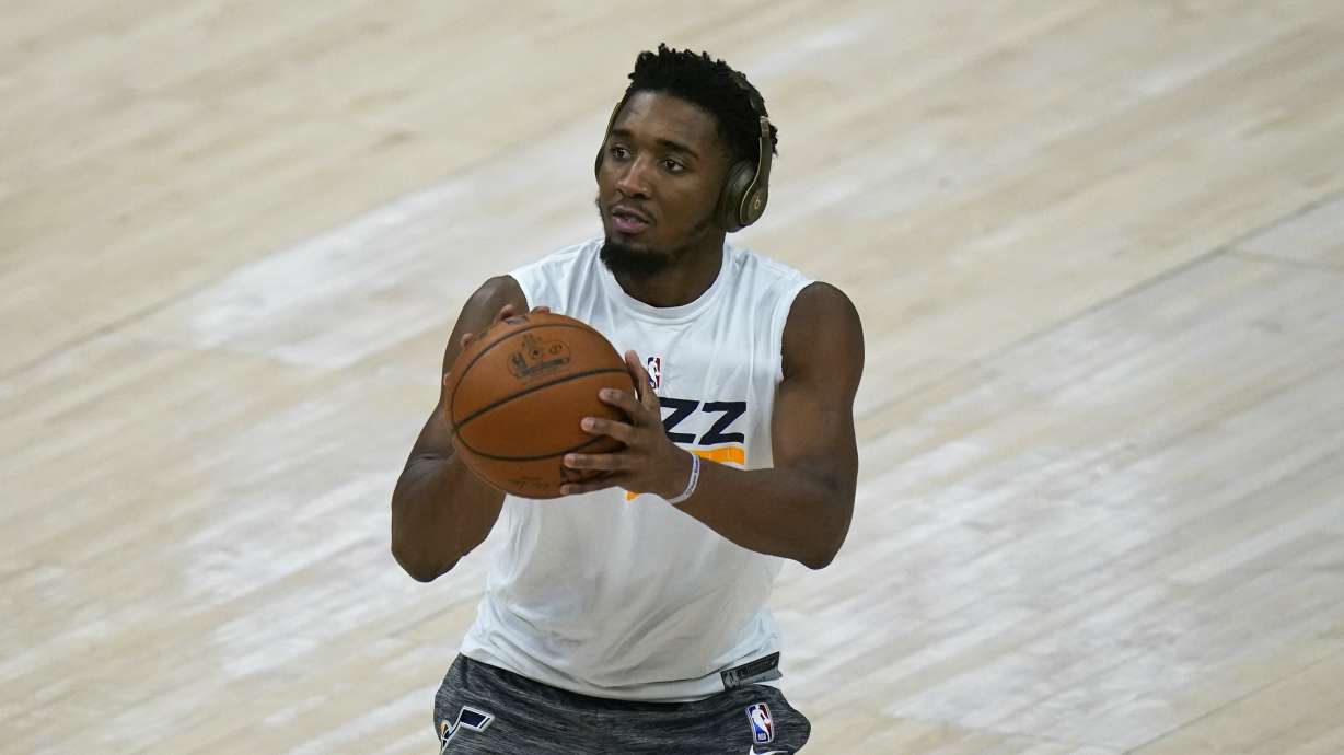 Utah Jazz guard Donovan Mitchell warms up before an NBA basketball game against the Los Angeles Clippers Friday, Jan. 1, 2021, in Salt Lake City. (AP Photo/Rick Bowmer)
