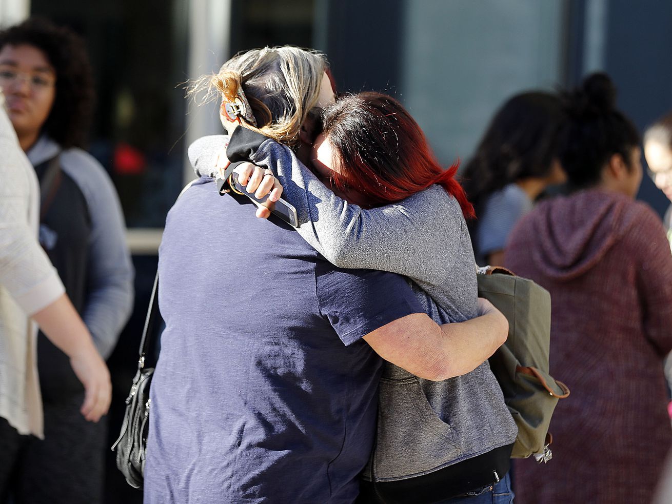 Parents and students hug as they reunite outside
Mountain View High School in Orem on Tuesday, Nov. 15, 2016,
following a stabbing at the school.